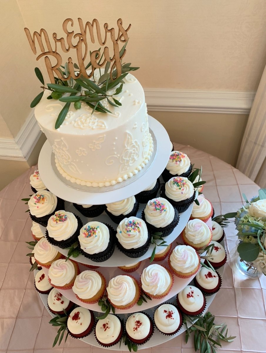 cupcake tower display with cake topper