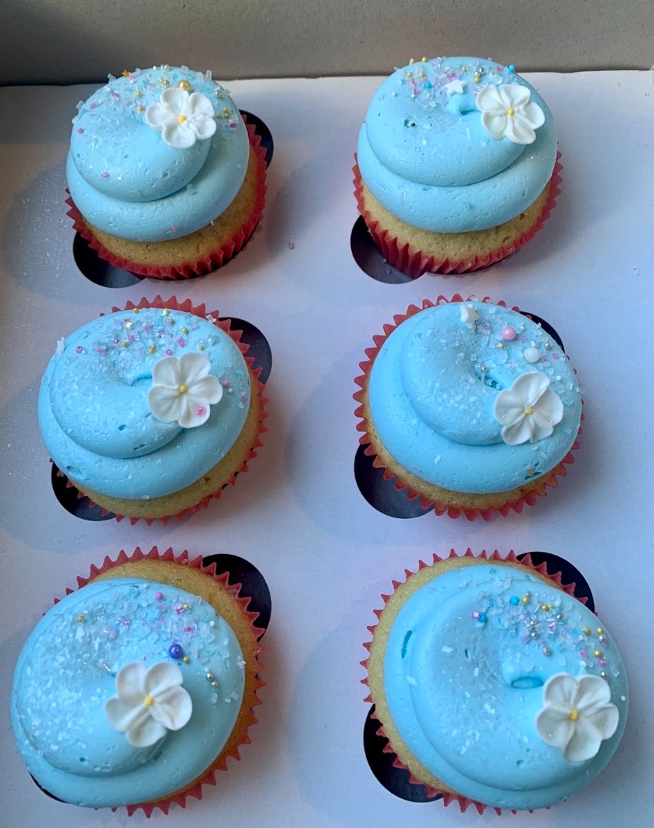 blue cupcakes with white flowers